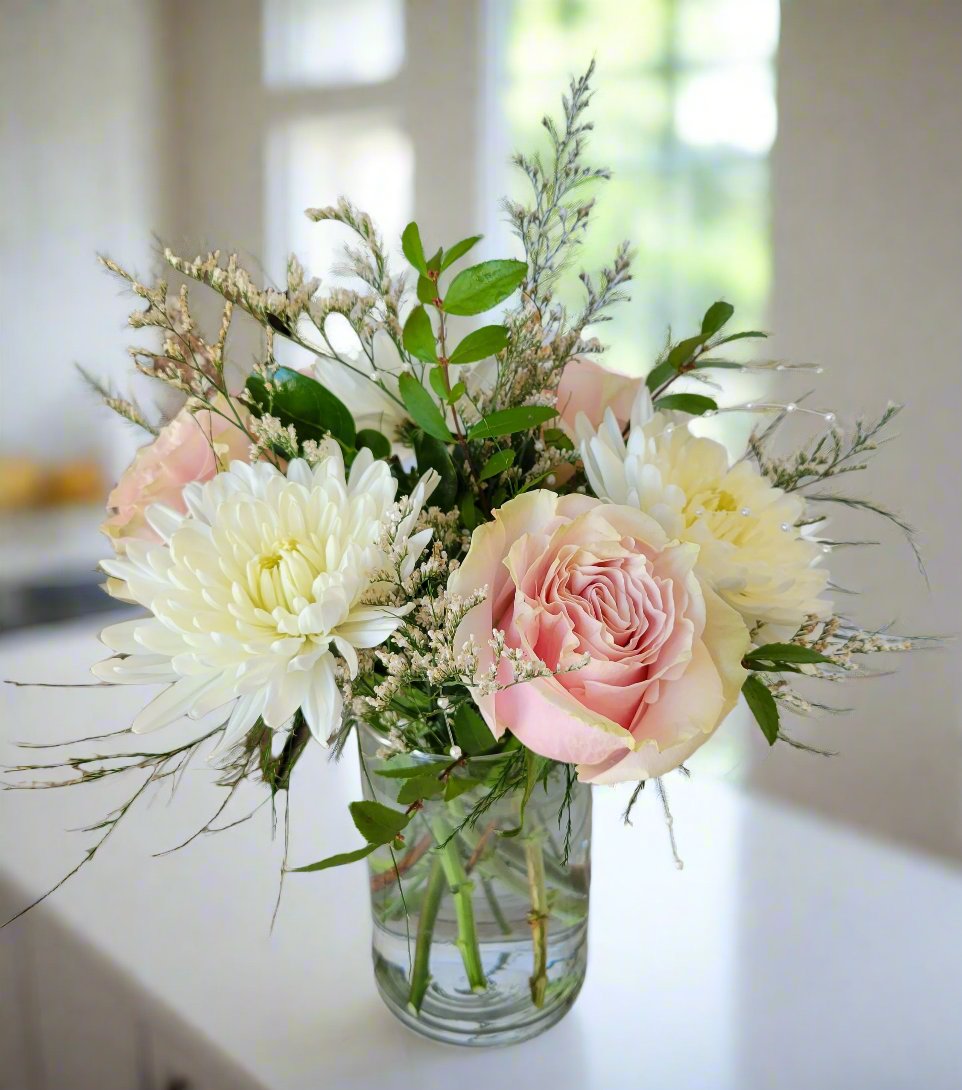 Send roses and flowers in Winnipeg. Longlasting flowers in pink and white by Winnipeg Florist. Valley Flowers