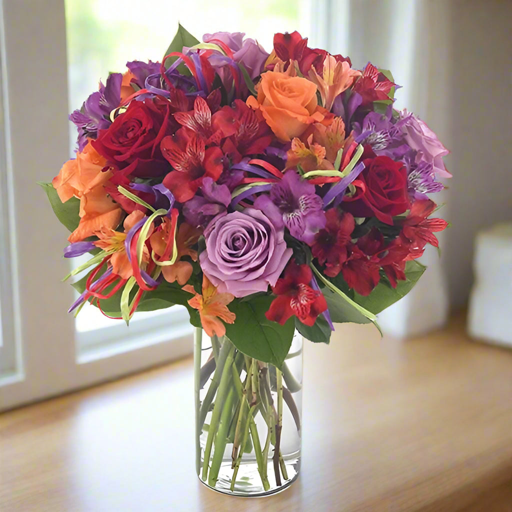 Colorful roses and alstromaria make a perfect flower arrangement for birthdays!