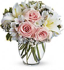 Lily and rose flowers in clear vase delivered same day by local florist in Winnipeg
