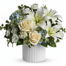 Beautiful dreams white and blue flowers for sympathy delivered by Winnipeg Florist
