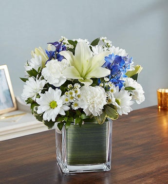 Pretty blue and white flowers by Winnipeg Florist. Valley Flowers.  Send flowers Winnipeg  in shades of blue and white. 